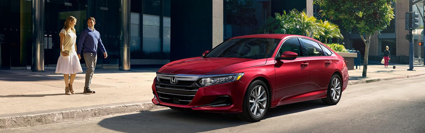 A red 2021 Honda Accord parked in the city