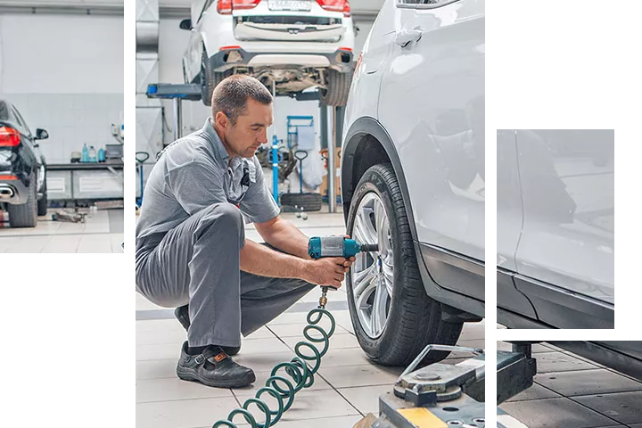 Service technician checking the tires on a vehicle at Toyota of Tampa Bay