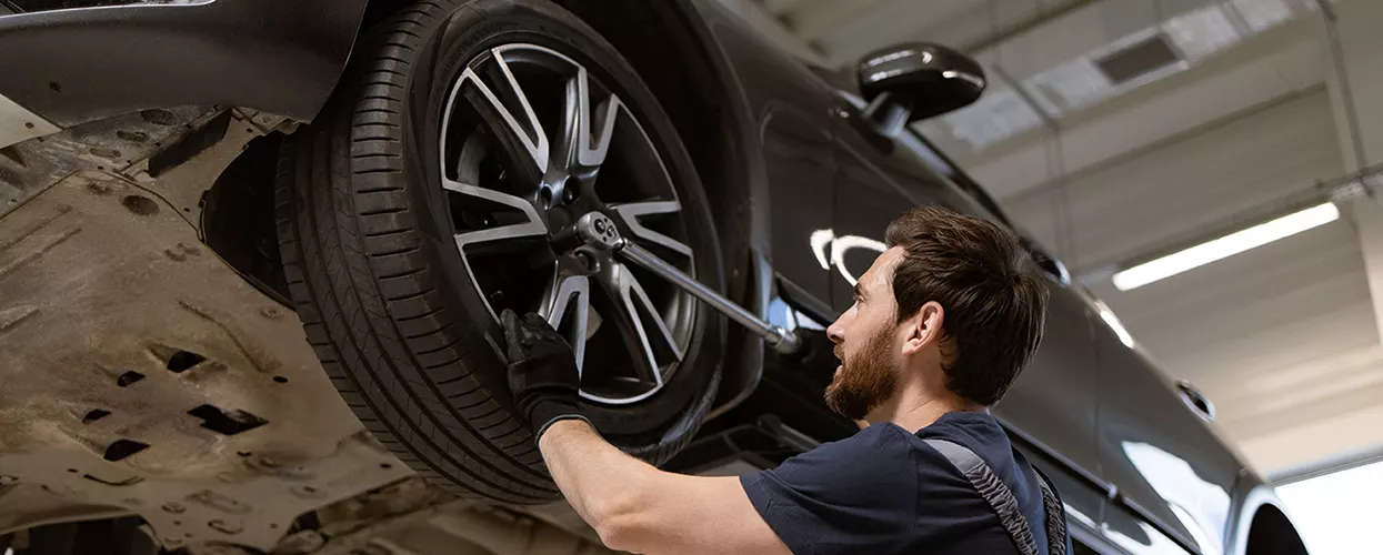 Service mechanic working on a toyota vehicle