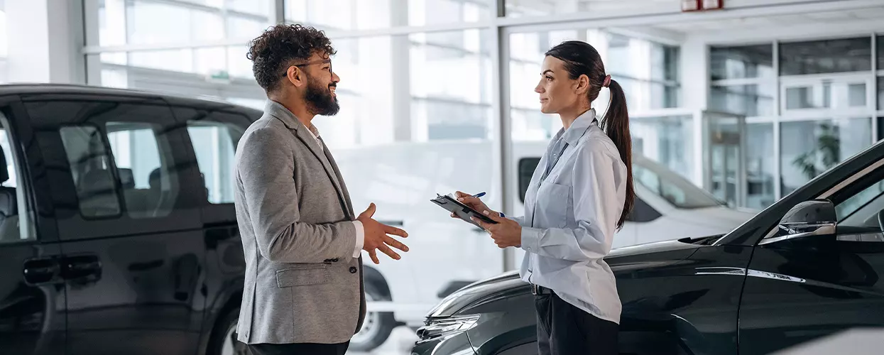 Customer talking to a car salesman