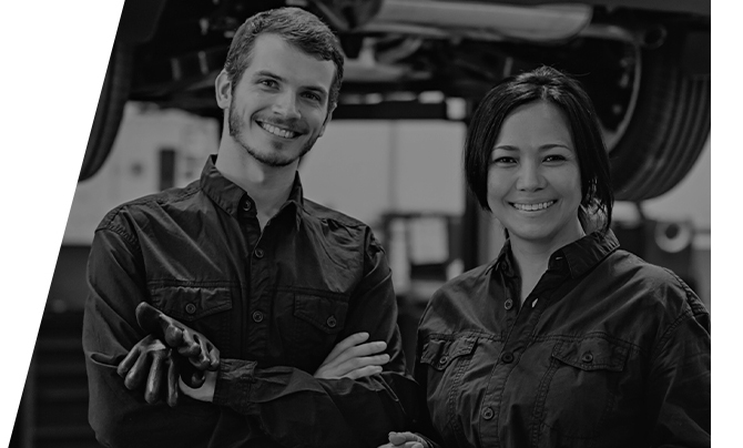 2 technicians in the garage ready to service