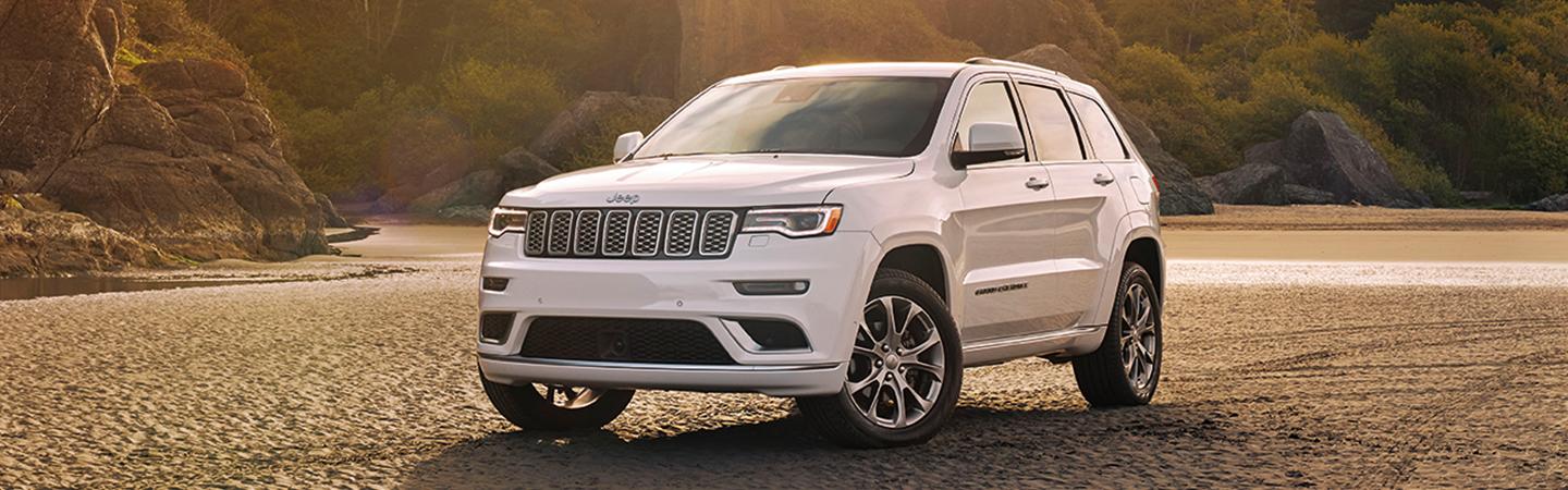 White 2021 Jeep Grand Cherokee parked