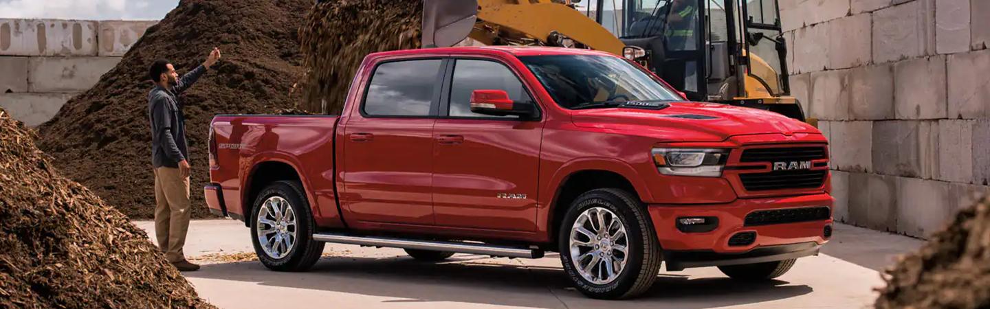 Red 2021 RAM 1500 parked at a work site