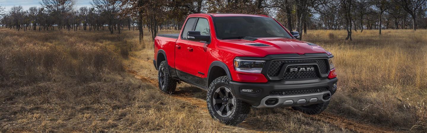 Red 2021 RAM 1500 parked in the wilderness