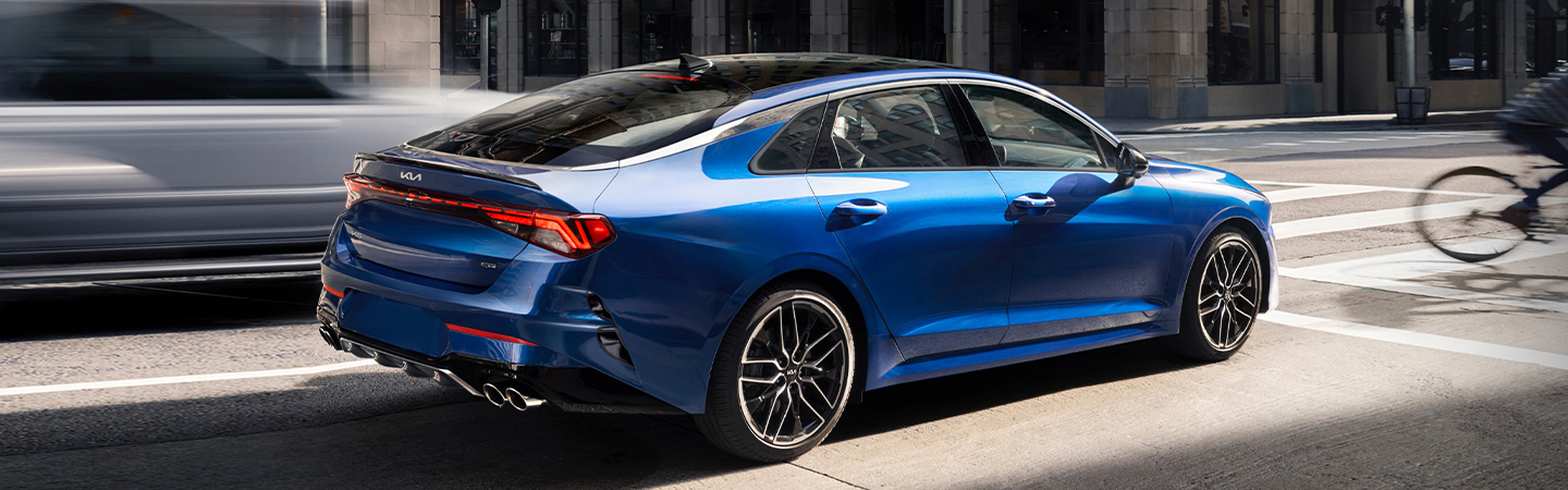 2024 Kia K5 Specs side back view in blue