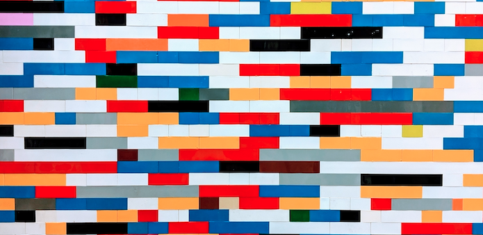 A wall of colorful bricks like Lego.