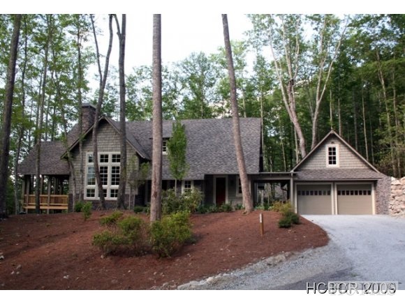 his 5 bedroom, 5.5 bath home has plenty of room for the family and entertaining guests. Master on main with lower level family room, wine cellar and guest bedrooms with two additional guest bedrooms on the upper level. Springfed stream on the left side of the lot near the kitchen and outdoor living area. Living room and porch offers wood burning fireplaces with gas starters. Energy star efficient home, tankless water heater, water cop, hardwood floors and more. Sleeps up to 14 and has an excellent rental history. Priced at $1,195,000.  Furnishings negotiable.