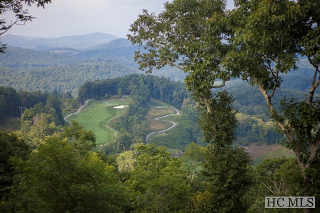 Unbelievable mountain and golf course views from this oversized lot located on a private gated road within Old Edwards Club at Highlands Cove. Great building site perched above 4,300 feet.
