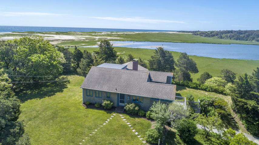 You can change a house but you can't change a location, and with this spectacular waterfront location, you won't want to! Situated in Orlean's desirable Pochet Neck neighborhood, this home enjoys private beach access to a remote section of Nauset Beach across a fabled boardwalk over National Seashore land. Striking water views from nearly every room and plenty of land for outdoor fun and relaxation. Property includes an adjacent lot offering privacy and unobstructed views of Pochet Inlet and Little Pleasant Bay. The home has been lovingly maintained and improved, so you can keep it, update it, or bring your architect to discuss a complete remodel. But don't miss out on this rare opportunity to own this exclusive Pochet property and the treasured memories it will surely help build.