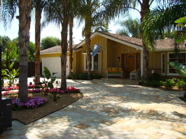 This fantastic home is designed for entertainment both inside and outside, 100 percent completely redone to perfection. It has 3 bedrooms, 2.5 bathrooms, 2 fireplaces inside, 1 fireplace outside, 2,437 square feet of living space inside and much more outside. The lot size is 11,175 square feet, tile is throughout the interior and exterior. French doors lead you to the incredible back yard living space which includes full covered bar and entertainment center, fire pit, heated pebble tech pool, jacuzzi tub in an enclosed room, tiled walkways throughout the property, an office room outside of the main residence, covered outside fireplace and sitting area, separate building for the laundry room. Home is in Walnut Acres and in the El Camino High School district.