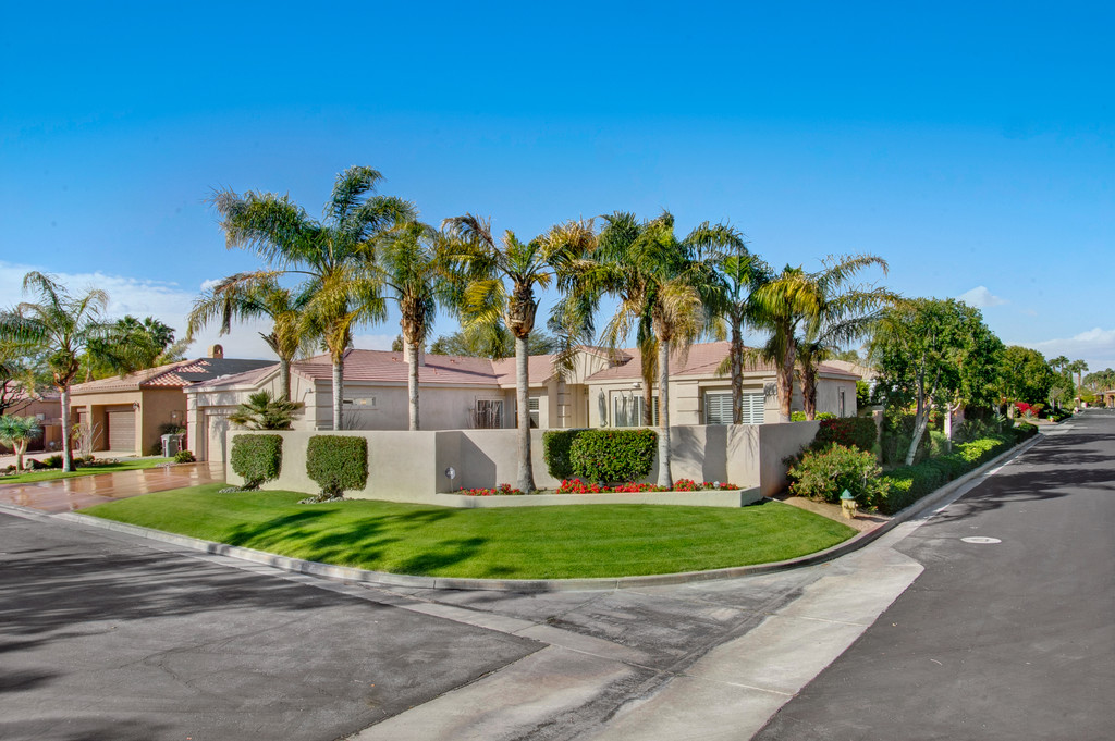 Sunterrace is one of Palm Desert's most Prestigious Gated Communities, centrally located at the corner of Hovley & Eldorado. Very Low HOA fee of $135.00 per month.This unique location has Southern Mountain Views as you enter this walled, premium corner lot that sits high off the street with a private front yard with a Pool and Spa. Enter the home through french double glass doors into 2500 plus square feet of living space. This spacious 4 B/R, 3 Bath home has white plantation shutters throughout. The open floor plan allows for lots of sunlight, Southern Mountains and Pool Views from almost every room. Private park-like Back Yard with small patio and lots of citrus trees lining the exterior wall. Large kitchen with granite counters, double ovens & gas cook-top. Breakfast area, family room with gas log fireplace. Surround Sound and Intercom system throughout both interior & pool area. Beautifully Landscaped, dual AC units, 3 car Finished Garage with Cabinets.