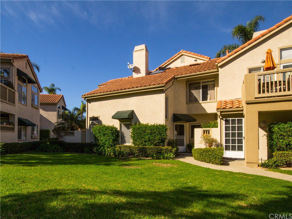 Beautiful turn-key unit offers two bedrooms, loft and two baths. Everything about this home suggests spaciousness with soaring vaulted ceilings and dramatic high glass windows. The second-floor loft makes a perfect office or peaceful retreat with natural light. The Sunset model is the largest model in the community and offers a main floor bedroom and bath. Upgrades include travertine floors, granite counters and a beveled mirrored dining accent wall. Inside laundry room and direct access garage. Great location in desirable Upper Palm Court with a park like setting. Enjoy the tennis court, pool, spa and tot lot. Abundant walking trails and sports park nearby. Nicely situated to surrounding cities of Laguna Beach, San Juan Capistrano, Aliso Viejo and just 4.3 miles from the Dana Point Harbor. Welcome to your dream home!