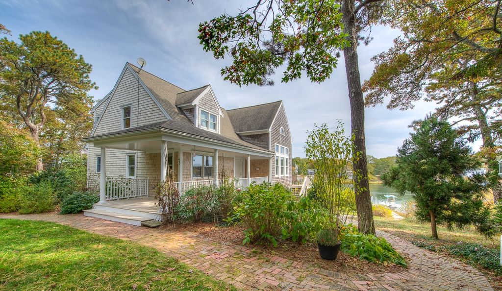 <b>This property sold on 2/26/2017 and is no longer available.</b>

Immerse yourself in Cape Cod's nautical wonder with this stunning home. Perched alongside the Cape's pristine Eel River, with unobstructed access to Nantucket Sound, this house is a dream for boat owners and water aficionados. Your own private dock allows you to enjoy an afternoon fishing or soaking in the rays on the sands of Washburn Island. You can also seize the day by kayaking, paddle boarding, shellfishing, reading a book by the water's edge, or even exploring the village of Falmouth. As you enter the house, you are greeted by a wall of windows with a magnificent panoramic view of the shimmering sea, spanning all the way to Martha's Vineyard. The spacious living room with high ceilings and sun drenched hardwood floors is the perfect spot to kick back and relax after a long day. Unleash your inner chef in the kitchen and enjoy your meal on the deck or dining area, both with unbeatable views. Dock permit available.