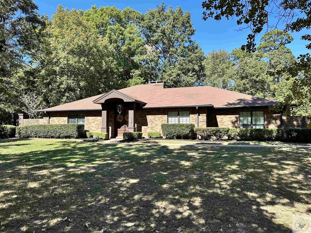 4 bedroom, 2.5 bath TISD home in the heart of Dogwood Estates. This property features two master suites on the left wing of the home. The secondary master would also work well for a home office as it is just off the entry. The primary master suite has a jetted tub, tiled shower, dual walk in closets and private access to the back patio. The laundry room has tons of storage and a built in desk. The back of the home has large windows overseeing the back patio and the large backyard. Check out those private views! The tree lined division between you and your neighbors gives you a secluded feel! Just off the patio, there is a stone fire ring to fill up with logs and stay cozy on those chilly days and nights as you enjoy being outdoors. Extra features worth noting are the cozy wood burning fireplace, wiring for sound indoors and out in several areas, a dry bar with wine storage, granite throughout, and a two car garage with a large storage and workshop area with power sources. Be sure to check this one out!
