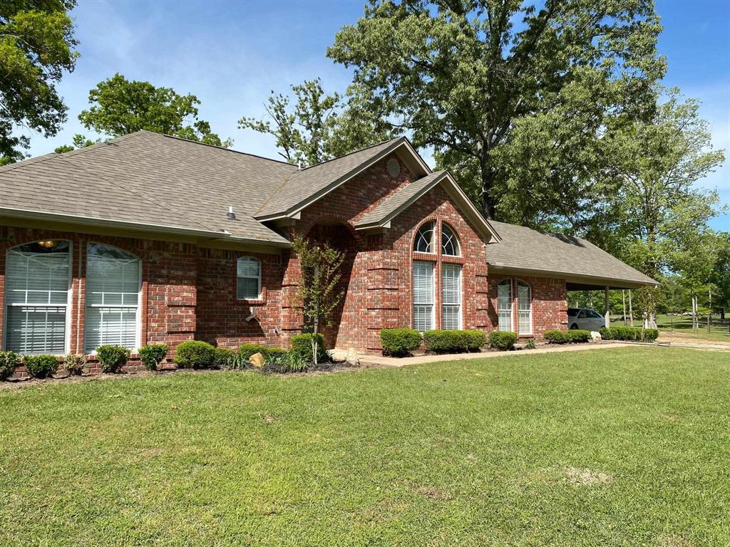 Really nice place to call home! Beautiful 3/2 brick (split bedroom arrangement) with formal dining, sunporch plus office! Sits on 14 acres with 40x40 metal shop, located in the Redwater School District. This home has been lovingly well-cared for and it shows!!!