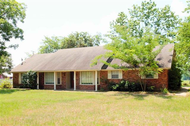 3 bedroom 2 bath home in Pleasant Grove school district. The front yard has a park feel as the home is hidden from street view and one side of the property is tree lined for additional privacy. This home has tons of storage throughout, a wood burning fireplace, and a sunroom that overlooks a pasture of horses. The home is situated with on 1.1 acre lot with the option to purchase additional land. See aerial for accurate boundary lines.