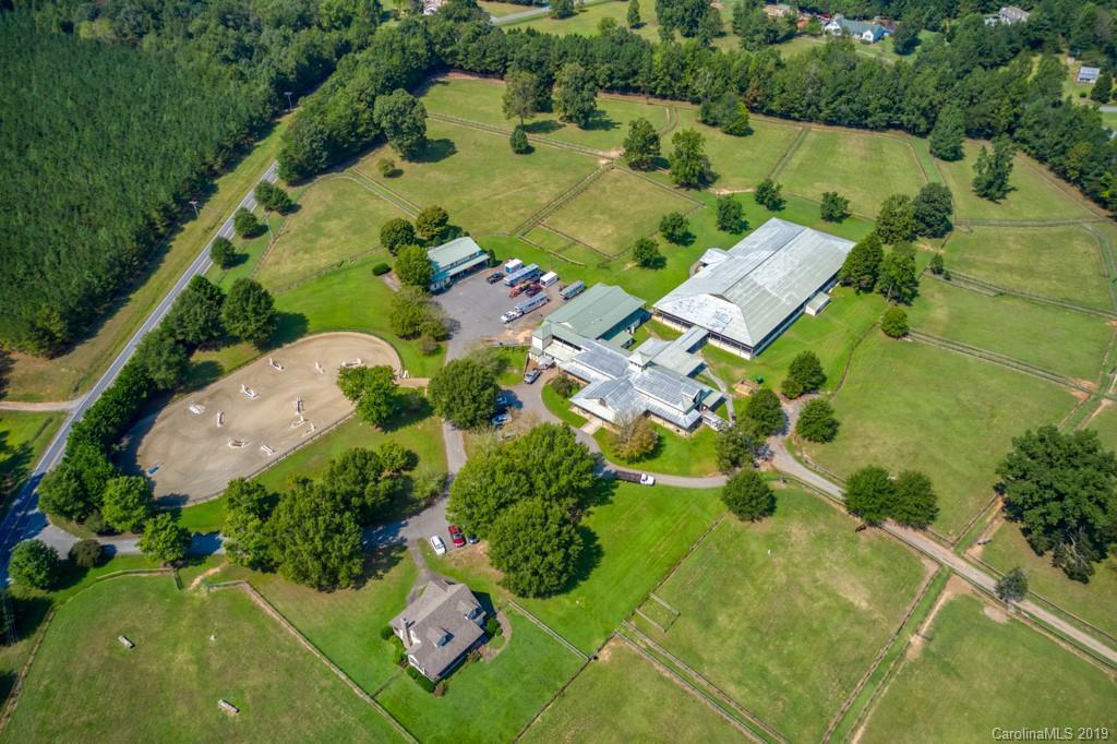 Listing courtesy of Re/Max Advantage. Still Creek Farm, one of the area's premier boarding, training, and rehab facilities, is now available. The property is located just minutes from Landrum SC w/ interstate access which is important getting horse transports into and out of. There is one main residence and 2 guest apartments with room to build a larger main residence. The custom barn offers 30, 12'x12' stalls with center isle and dutch doors to the outside. The facility also utilizes an Aquatred which is an in-ground underwater treadmill and is the perfect method of rehabilitating and conditioning your equine athlete. The outdoor ring is 120'x240 and the covered indoor 110'x220'which has the GGT footing, auto mister system and covered viewing. The 50+ AC property has plenty of grass paddocks with horse safe wire mesh fencing. Still Creek Farm is minutes to TIEC and walking distance to Tryon Equestrian Hospital. Still Creek Farm is the perfect Equine business opportunity or just a private farm. CETA trail access.