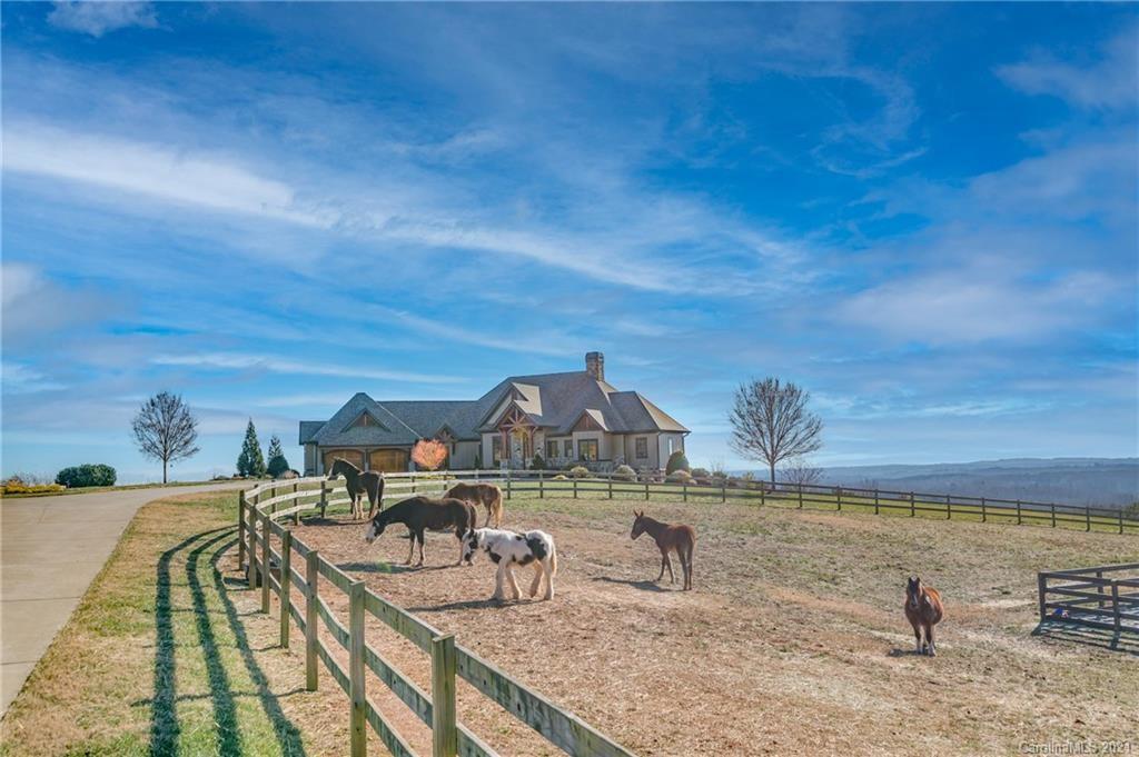 Listing courtesy of Sotheby's. Custom luxury built 2015 horse farm designed by architect Garry Price with Design Elite & built by equally impressive accredited master builder Skip Brewer with Walnut Cove Builders. Thoughtfully designed by J. Kelly Murphy III, architect and horseman, the 18.72 acres includes over 12 acres of 3 board fencing divided into five paddocks. The remaining acreage is devoted to the homesite itself and to woods with a creek. Enjoy direct ride-out to the FETA trail systems which is approximately 125 miles in length. This amazing property also connects to the CETA trail system that has approximately 30 miles of trails. No expense was spared to provide the highest quality in luxury materials. Doors are Knotty Alder & cabinetry is clear Alder. Decking boards are IPE. The exterior of the home is cement board siding with a 30-year architectural roof. Open floorplan creates a great environment for entertaining. Master bedroom and home office is all on the main floor.