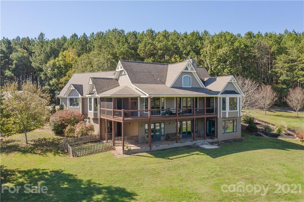 Listing courtesy of Claussen Waters. This is an exceptional equestrian property with an exquisitely crafted residence. It consists of 13.46 gently sloping acres, most of which are fenced paddocks with a run-in shelter, together with a 100x240 riding ring. The 63x39 stable is a center aisle, 6-stall affair, with a wash stall, tack room, feed room, hayloft, and a garage. It also includes a lovely apartment. There is also a 2647 square foot building that is presently used as a professional woodworking shop. The residence is located so that it overlooks the pastures and riding ring, with distant views. A spacious master suite spans the entire western end of the main level. The principle rooms occupy the remainder of this level blending together in an open concept. Three cheers for a fantastic kitchen that is appointed with the highest quality appliances. On the lower level, there are two bedrooms, two baths, a family room, and a spacious office/fitness room. The property has direct access to the CETA trail system.