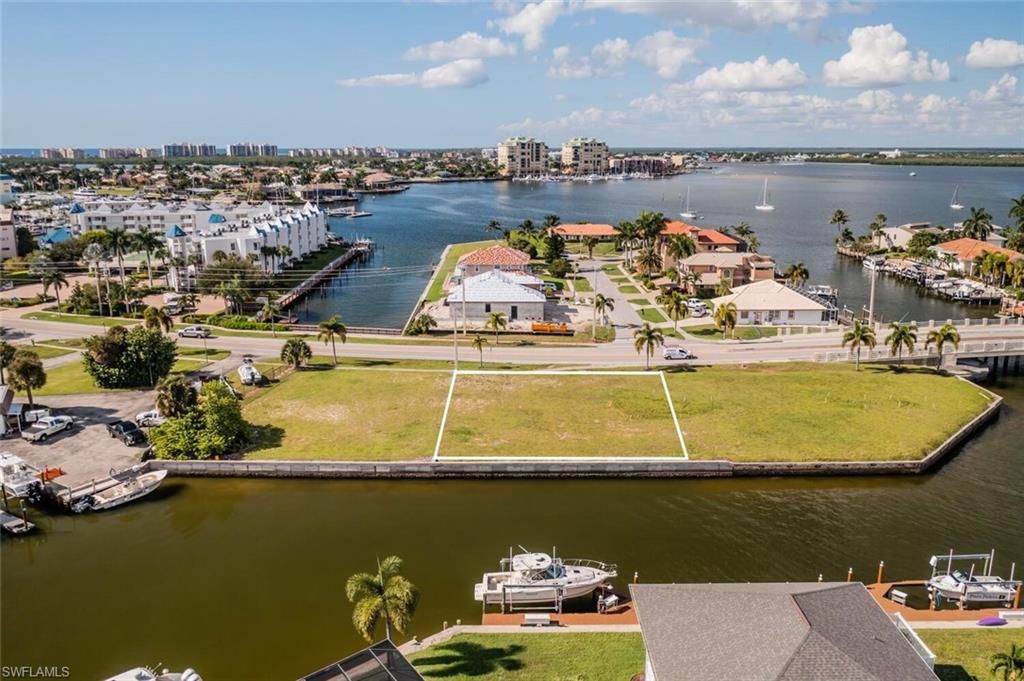 Represented the Buyer - Great Boating Location only 1 lot away from the Bridge leading to open direct access to the Gulf. 100 ft. of water frontage to accommodate large dockage for your boat, wave runners, etc. Southern Exposure and close to all the conveniences in town for shopping, fine and casual dining and plenty of entertainment.