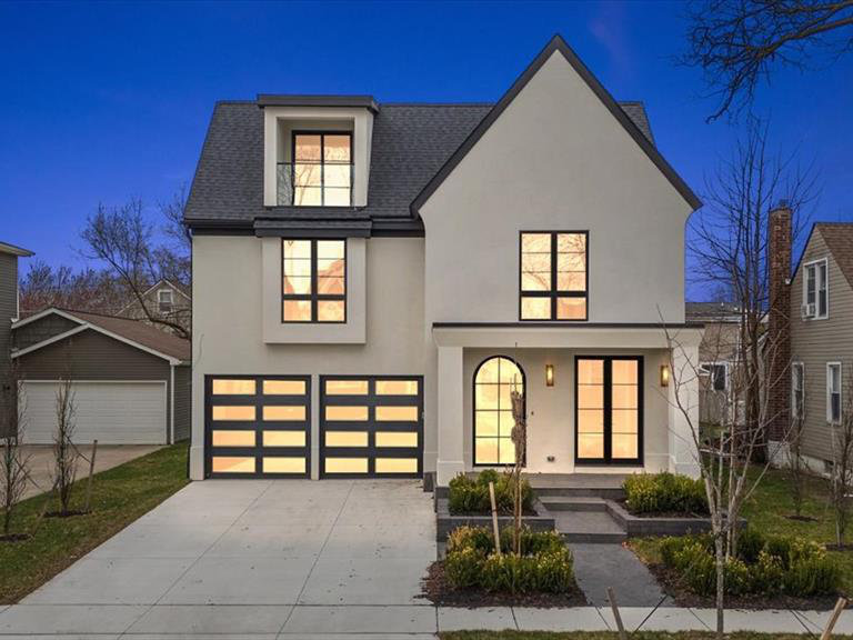 Dreamy Modern Tudor Built by AG Design in 2025 - this striking modern Tudor boasts sleek design, high-end finishes, and exquisite decor. Stunning curb appeal sets the stage for what lies within. Step into the foyer, where elegant, checkered marble floors lead to a stylish library/office with custom wall details. The open-concept living area is designed for both comfort and sophistication. A show stopping island kitchen features black cabinetry, sleek marble countertops, and fluted hood. The living room is anchored by a beautiful fireplace, custom built-in arched wet bar, and a door wall opening to the backyard patio. The adjacent dining area with an inset wet bar seamlessly connects to the kitchen and living space. A convenient mudroom off the garage of the home provides easy access to your attached 2 car garage offering ample storage. Upstairs, the luxurious primary suite is a true retreat with two spacious walk-in closets, and a stunning ensuite bathroom featuring beautiful flooring, an oversized Euroglass shower, a stylish tiled wall, a double vanity, and a tub with a ceiling filler. Of the 3 additional bedrooms 2 share a well-appointed full bathroom, and the third is a ensuite bath, while the second-floor laundry adds everyday convenience. The third floor offers additional flex space, with a balcony, and a full bathroom perfect for a private lounge, home office, or entertainment area. The finished basement expands the home's versatility with a large recreation area, a gym/flex room, a 6th bedroom with an egress window, and a full bathroom. Enjoy outdoor living in the private backyard, complete with a back deck, a patio area. Located just moments from Downtown Birmingham's premier shopping and dining, this home offers the perfect blend of luxury and convenience.