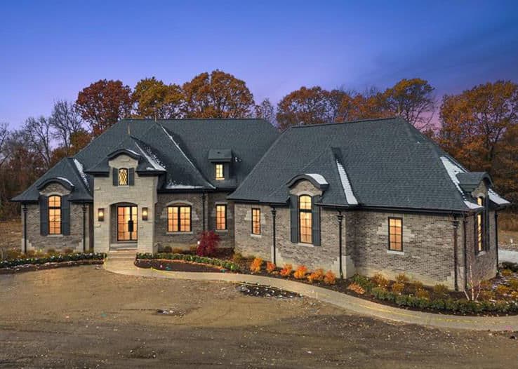 Welcome to an extraordinary opportunity to own a stunning 3,823 sq ft split ranch masterpiece by Lassale Homes, perfectly poised for completion by February 2026. Nestled in the prestigious Vistas of Oakland, this property redefines refined, transitional-style living. As you enter, you are greeted by an open-concept layout that effortlessly blends sophistication with comfort. The great room flows seamlessly into a chef's kitchen adorned with earthy-toned finishes and abundant cabinetry, complemented by high-end included appliances. Elegant wood-cased arches and expansive windows throughout the home ensure a light-filled, inviting ambiance. Step outside to the covered lanai, featuring a cozy outdoor fireplace, an idyllic space for year-round relaxation and entertaining. The private primary suite is a true sanctuary, offering lanai access and a spa-inspired bath complete with floating vanities, a luxurious soaking tub, an oversized shower, and a custom walk-in closet.Accommodating guests with style, a separate guest wing boasts two well-appointed bedrooms with walk-in closets, connected by a stylish dual-entry Jack and Jill bath. A private fourth bedroom upstairs, complete with its own ensuite and walk-in closet, provides the perfect retreat for family or guests. The property also features an oversized 3.5-car garage with tall ceilings and direct access to the lower level. The expansive basement, with impressive 10-foot walls, is ideal for a home gym, recreation space, or golf simulator setup, allowing for endless customization. Additional highlights include a full sprinkler system and included kitchen appliances, showcasing a commitment to quality and convenience. This exceptional home is waiting to make its mark, experience the allure of luxury living in the Vistas of Oakland. Your dream home awaits.