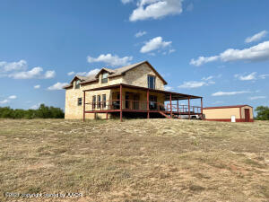 240.00 acres, more or less, including a beautiful Austin Limestone home with Central HVAC, large open concept kitchen/dining/living area with master bedroom and bath downstairs and a large upstairs loft with three beds and one bath. Has a large metal insulated barn with concrete floor, overhead door and side door. Approximately 190 acres is in improved Old World Bluestem Grass, with the remaining 50 acres in native pasture and mesquite trees. Utilized for cattle grazing, the property also provides some habitat and cover for wildlife, including deer, turkey, dove, quail, wild hogs, and varmints offering good hunting. Nearly new five strand barbed wire perimeter and cross fences with metal livestock pens and double metal gate entrance. See below for more details. See more for more details.

LEGAL DESCRIPTION: 240.00 acres, more or less, in S/2 of Section 309, Block W Brooks, W & NW Ry Co Survey, Hardeman County, Texas. (Abstract 377).

MINERAL RIGHTS: No minerals convey. Seller believes they own 100% of minerals.

WATER RIGHTS: All water rights will convey to buyer.

WIND RIGHTS: All and rights will convey to buyer.

SOLAR RIGHTS: All solar rights will convey to buyer.

WATER WELLS: There are two wells. One well was drilled and completed in April 2021 with 1 horsepower submersible pump that serves the house, barn and five stock tanks. Depth is 180' with 46' of perforated tubing in 100' static water. The second livestock well was drilled and completed in 2017 to a depth of 180' and serves one stock tank with a ½ horsepower submersible pump and tested at 30 gpm. (per Seller)

HOME: Beautiful Austin Limestone brick home fully renovated in 2013 with metal roof, central HVAC, water conditioner, tankless water heater, large open concept kitchen/dining/living area with master bedroom and bath downstairs and a large upstairs loft with three beds and one bath. The home has a large half wrap around covered and insulated porch/deck built with C Purlin and 4" tubing. Square footages should be verified.

BARN: A large metal insulated barn with concrete floor, overhead roll door and side door. Barn is plumbed out for toilet, septic, hot and cold water lines, although none is connected. Square footages should be verified.

FENCES: Nearly new five strand barbed-wire perimeter fence and some cross-fence. Other cross fences are average. All metal panel gates and a double metal gate at the entrance.

LIVESTOCK PENS: Steel pipe working pens, two holding areas, three sorting pens, loading chute, crowding round pen, and a 2 acre outside holding trap.

FSA BASE ACREAGE: 187.1 acres of Wheat Base with PLC Yield of 17. All in Old World Bluestem Grass established in the Conservation Reserve Program (CRP) in 1970's. The property has been out of CRP for the past 30+ years.

ELECTRIC: Two sources; Harmon Electric Coop line comes in from the northeast corner of property out of Hollis, OK, supplying one well, the house and five stock tank locations. South Plains Electric line from Childress, TX supplies one stock tank in southwest corner.

OTHER UTILITIES: Santa Rosa fiber optic Wi-Fi, cable, and telephone.

SEPTIC: Two septic systems, one for house. A second system for the barn has not been tied in yet.

ZONING: Agricultural. Located outside of any municipality.

EASEMENTS: Utilities. There are no known easements that will interfere with the operation of the property.

SCHOOL DISTRICT: Quanah Independent School District

TAXING DISTRICT: County, Hospital, School and Groundwater Taxes for 2020 were $1,641.51with Agricultural Value Exemption.

WATER CONSERVATION DISTRICT: Gateway Groundwater Conservation District.

HUNTING LEASE: None in place.

GRAZING LEASE: None in place.

PERSONAL PROPERTY: All furniture and fixtures in house including refrigerator, range, microwave, kitchen table and eight chairs, dishes, silverware, pots, pans, mixing bowls, gun safe, sofa, chair, ottoman, two end tables and lamp, bookcase used as television stand, television, soundbar, two floor rugs, Queen Bed downstairs and two dressers, three queen beds upstairs, love seat, coffee table, game table and four chairs, two chest of drawers, one night stand, all bed linens and towels. Propane Tank, outdoor grill, two sturdy deck chairs with cushions, four rockers and two portable tables.

POSSESSION: Upon closing and funding.

NO TRESPASSING. PLEASE DO NOT ACCESS PROPERTY WITHOUT BEING ACCOMPANIED BY LISTING BROKER.

As with any Exclusive Listing Agreement, owners are not to negotiate with any prospective buyers, but to refer all prospective buyers to the Listing Broker, so please do not contact any of the owners directly. Please direct all questions to Listing Broker. This property is not for Rent, not for Lease and Owner Financing is not available.

Buyer's Broker must be identified upon first contact with Listing Brokerage Firm and must accompany buying prospect on first showing to be allowed brokerage fee participation. Otherwise, the fee participation will be at the sole discretion of Listing Broker.

PROXIMITY IN MILES FROM: Childress 18; Quanah 19; Hollis, OK 24; Wichita Falls 98; Amarillo 135; Lubbock 156; Abilene 157; Oklahoma City 185; Fort Worth 212; Dallas 238; Midland 263; Wichita, KS 345; San Antonio 402; Albuquerque 420; Shreveport 426; Hot Springs, AR 450; Springfield, MO 470; Colorado Springs 494.