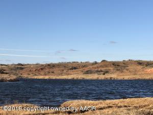256.605 acres, more or less - A rare Childress County find with easy access, excellent grazing, hunting, fishing, deep draws and live water, located only eleven miles southwest of Childress! This 256.605 acre tract has a live creek, that feeds a 2.67 acre pond stocked with catfish, then springs again crossing the entire length of the property with several areas that hold water year around. There are approximately 100 acres of improved grasses. The creek bottoms and all small draws leading into the main deep draw have Bermuda grass. The remainder is in native pasture, mesquites, brush, stacks of old grubbed trees, and lot of big trees along the live water creek, all providing grazing and shade for cattle and excellent heavy cover for wildlife including mule deer, turkey, dove, quail, hogs.
LEGAL DESCRIPTION: 256.605 acres, more or less, in northwest part of Section 719, Block H, W & NW RR Survey, Childress County, Texas.
MINERALS: Subject to previous reservations of record. No minerals convey.
TOPOGRAPHY: Excellent topography with rolling grassland and deep draw crossing the entire property from west to east and another deep draw crossing southwest corner. Terraces on most of the Improved grass acreage.

WIND & Water: All wind and water rights will convey to buyer.
FENCES: New fences, set of cattle pens in Northwest corner only half mile from paved FM 2103.
IMPROVEMENTS: 2.67 acre pond. Metal cattle pens.
SURVEY: Yes, dated November 28, 2017.
FSA BASE ACREAGE: This property is not in any government programs.
WATER: Live creek runs across the property from west to east with 2.67 acre pond in the middle of the property. The creek has several locations across the property that hold water. One stock well has not been used in several years due to the live creek and large pond accessibility. Windmill tower does not convey.
UTILITIES: Electric: No. Natural Gas: No.
PERSONAL PROPERTY: None.
HUNTING LEASE: None in place.
GRAZING LEASE: Owner is currently running cattle and would be agreeable to lease it from new Buyer.
ZONING: Agricultural.
EASEMENTS: There are no known easements that will interfere with the operation of the land.
POSSESSION: Upon closing and funding.