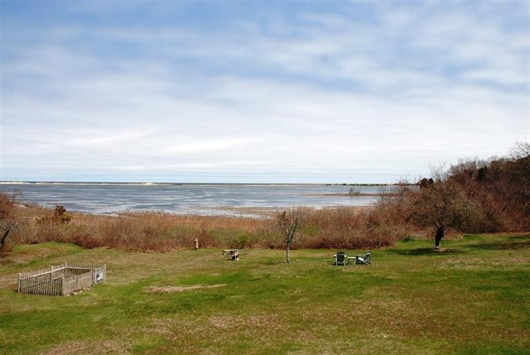Marsh front with views overlooking Town Neck and Cape Cod Bay. 4 BR older home. loaded with charm, many renovations, custom kitchen with fireplace, fireplaced living room, master suite with balcony and more. Walk to town, beach, boardwalk, shops, and restaurants.