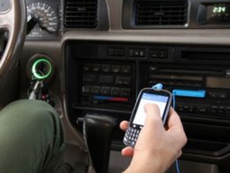 How to Listen to a Cell Phone's Music Player Through a Car Stereo