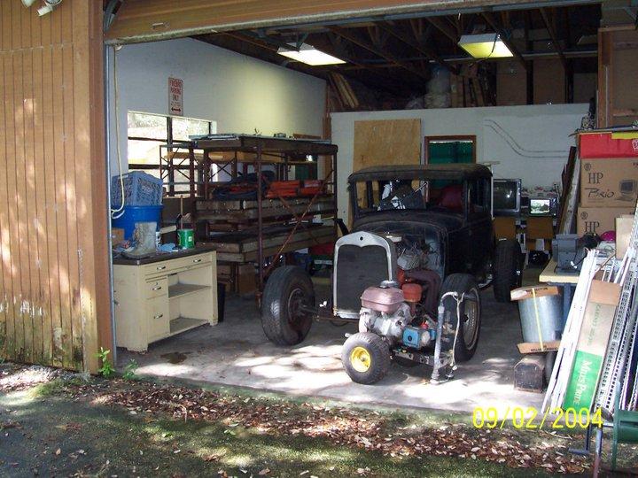 1930 Model A Coupe w/1968 Camaro drive train. Trying to become a street rod. Now located at Potato Lake.