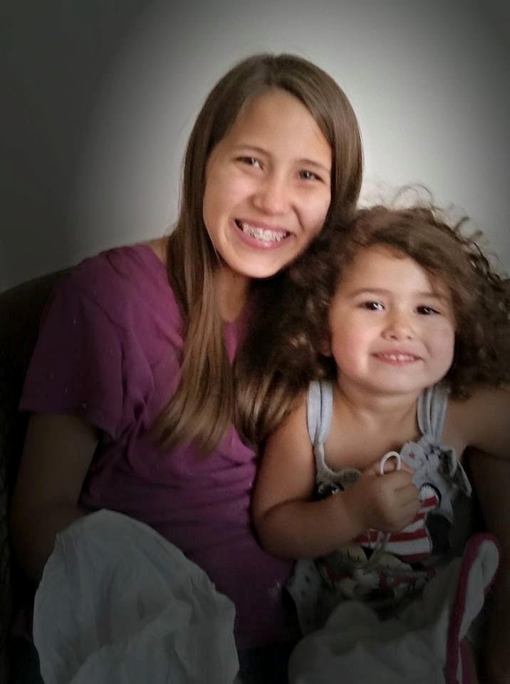 My girl tired from painting but still has time for her little Sissy