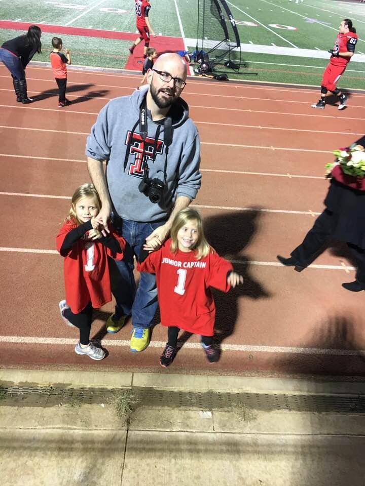 Jeff with Callie & Caroline. The twins are jr captains for the Colleyville Panthers for the coin toss tonight.