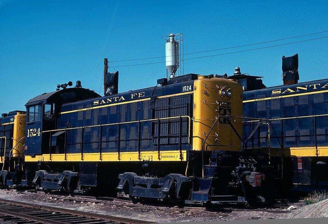 Spring 1976 ATSF ALCO switcher on the deadline complete with covered stack resting in the Calwa yard in Fresno.