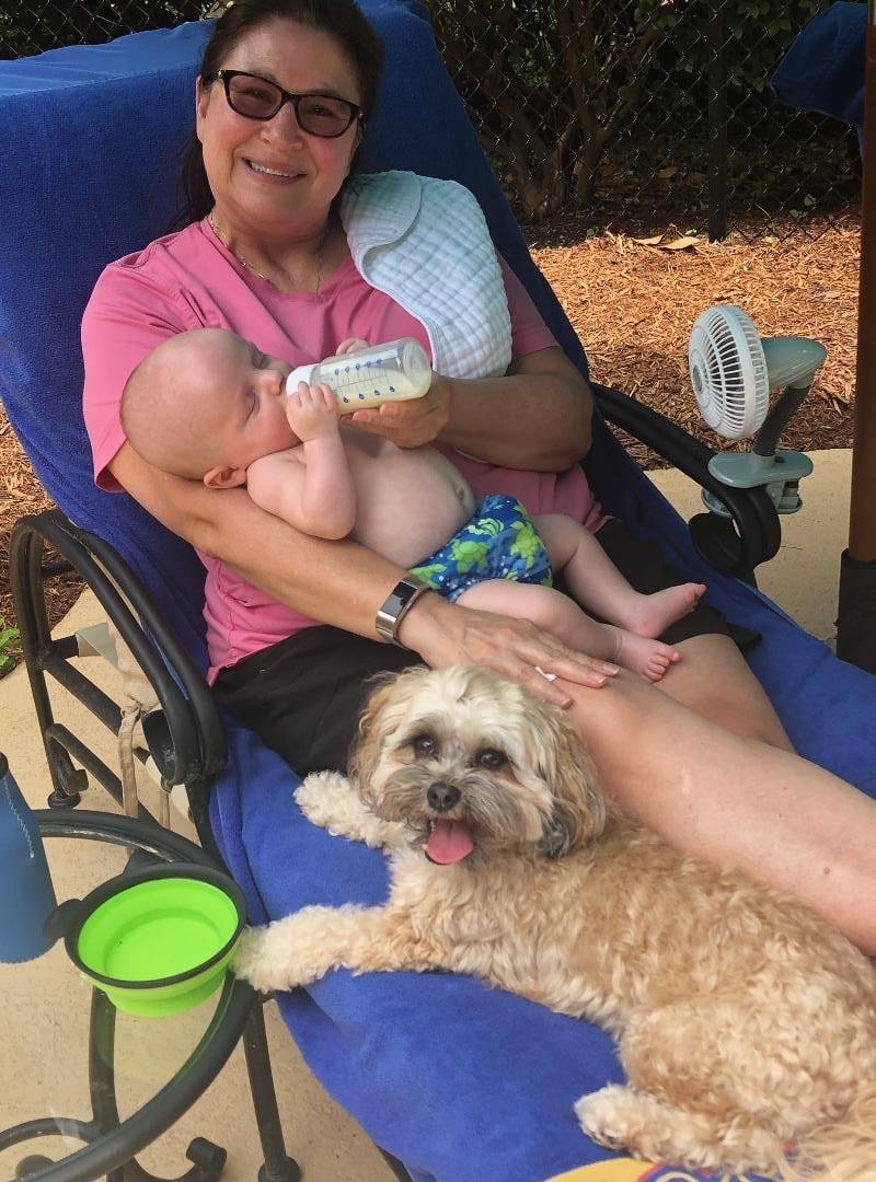 Debi with Henry... and our guard dog, Baxter. He has been incredibly protective of the little guy... quite funny, actually.
