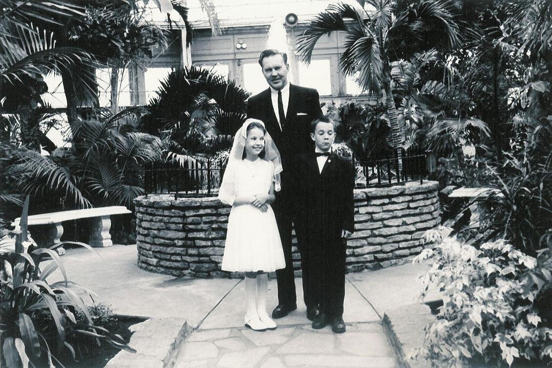 We had just had Communion at our local Catholic Church and then whet to Como Park for photos. Mom took the shot. I was saying something goofy to my sister Susan Garson just to make her crack up. Always the ham.