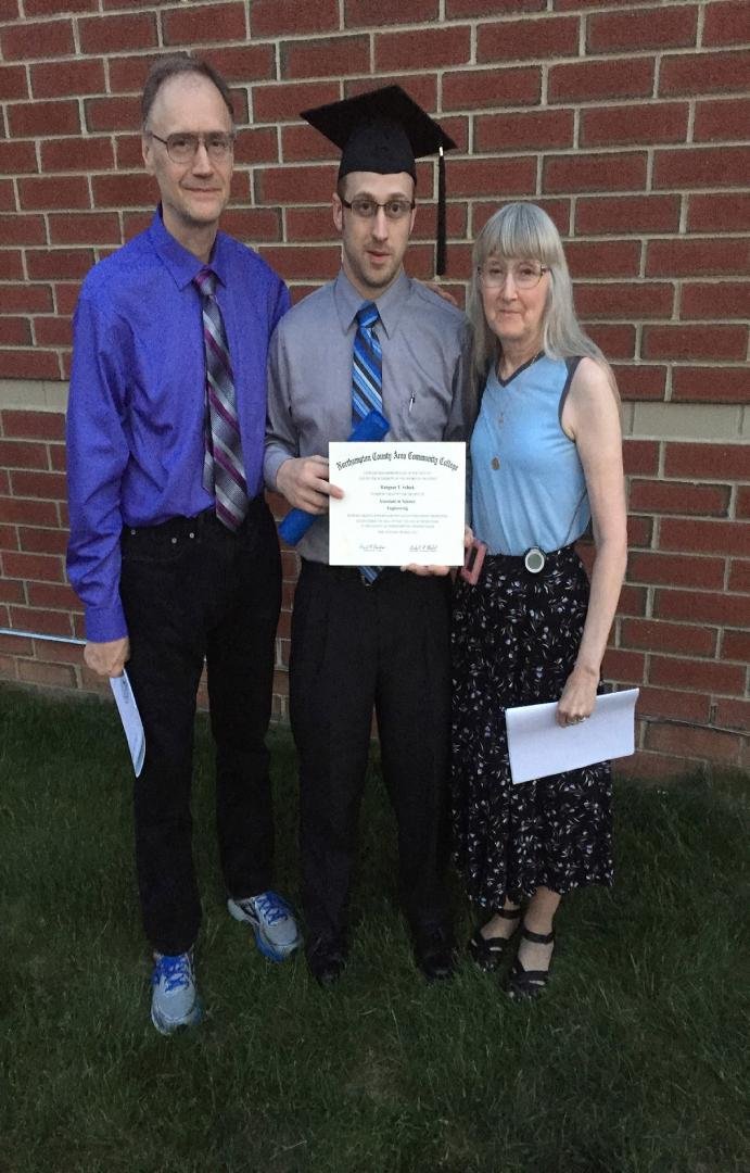 Proud parents of Rahgnar. Got his Associate Degree in Science & Engineering last night. Next stop for him is Lafayette.  Then we’ll kick him out!  LOL  When did I get so much forehead? Jeez...