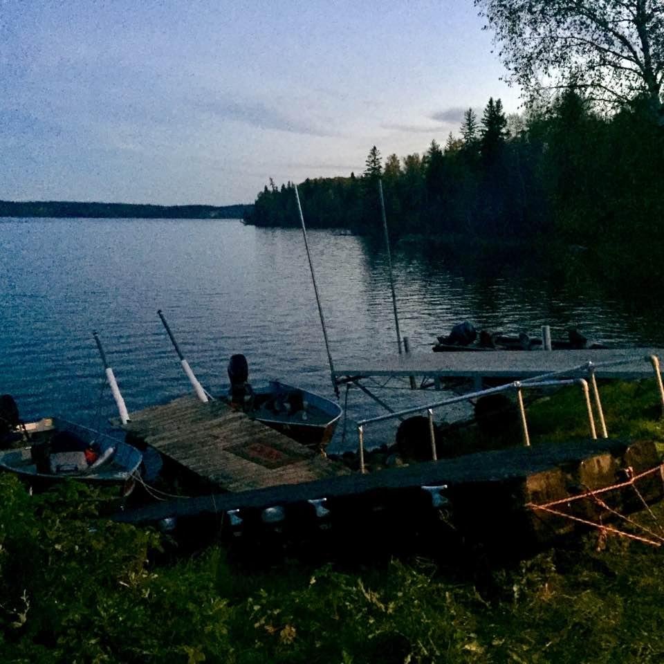 Closing up camp - boats are on the beach and the docks on the shore...