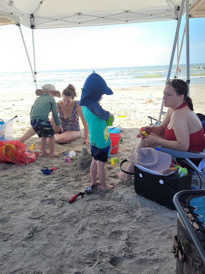 Under the tent for shade