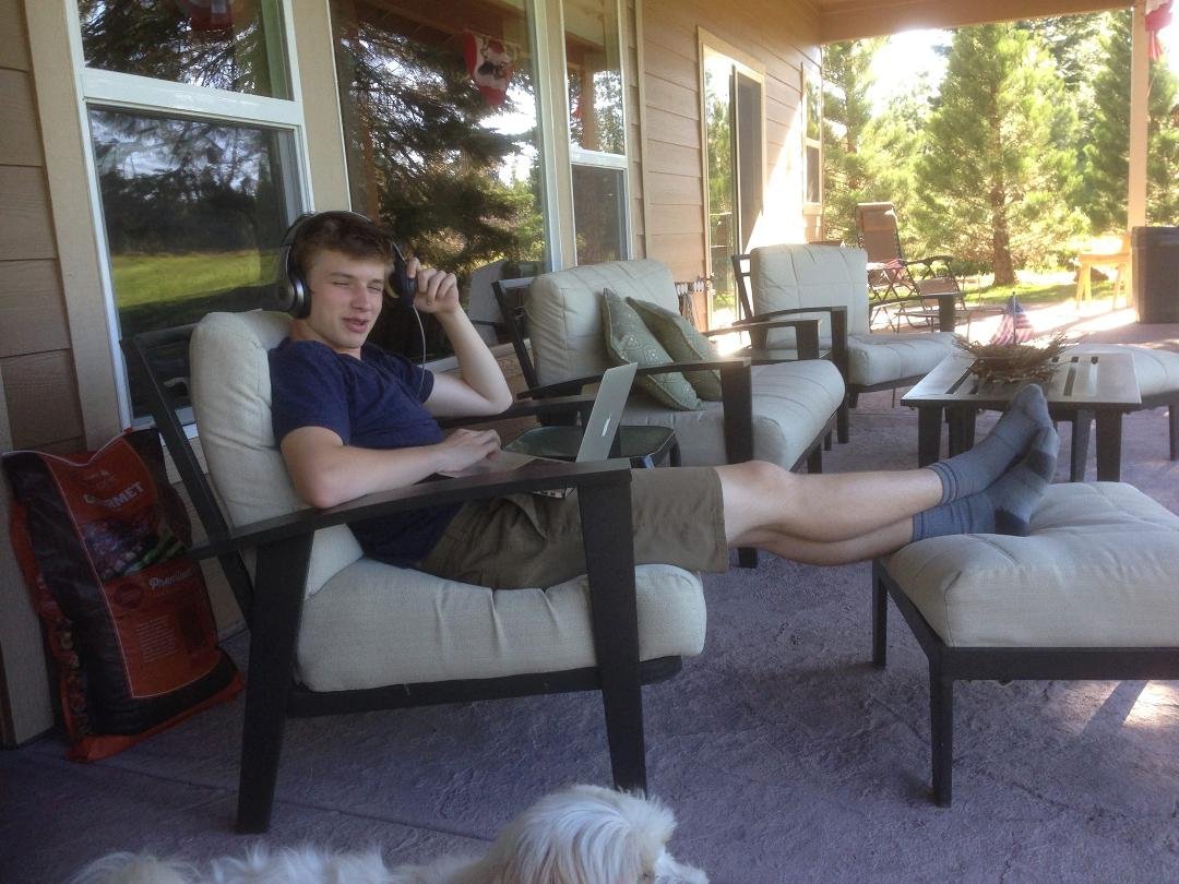 Colin Tait/ grandson doing his digital thing on the patio @ Walker's Wickiup Bailey Creek - Lake Almanor.