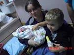 My Great Grandsons and my oldest daughter. Hunter was tying to share his popsickle with Cody, but Granny stopped him.