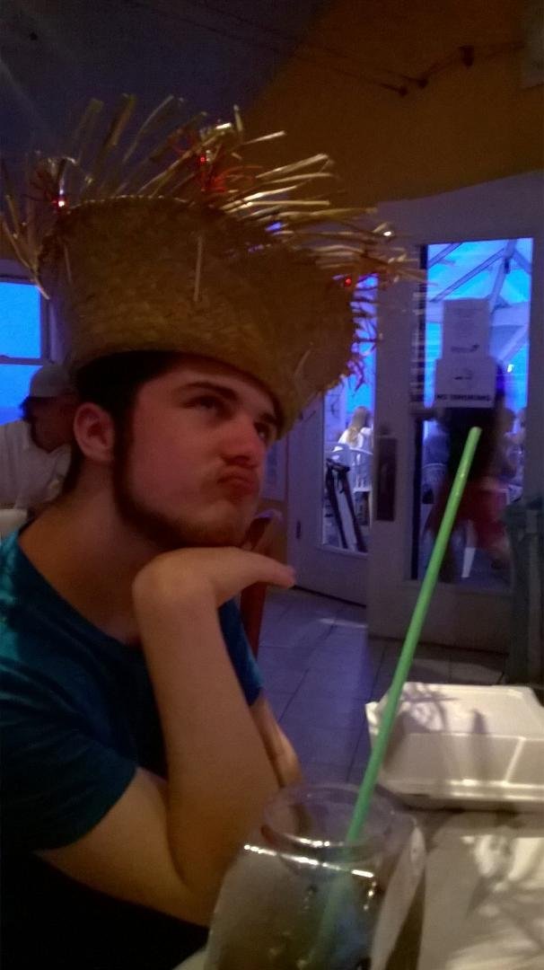 At the beach and Mango Mikes celebrating Sarah's birthday with a hat and drinks in fishbowls.