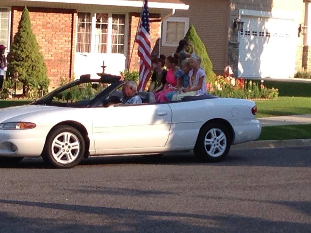 Boyd driving neighborhood girls in the neighborhood "Days 47" Parade.