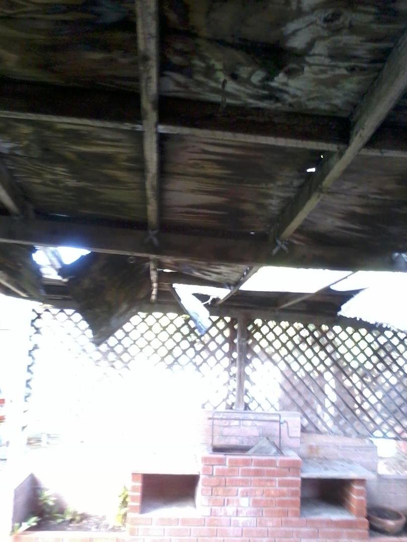 The work at the house FINALLY begins with the demolishing of our patio cover. This photo 1.