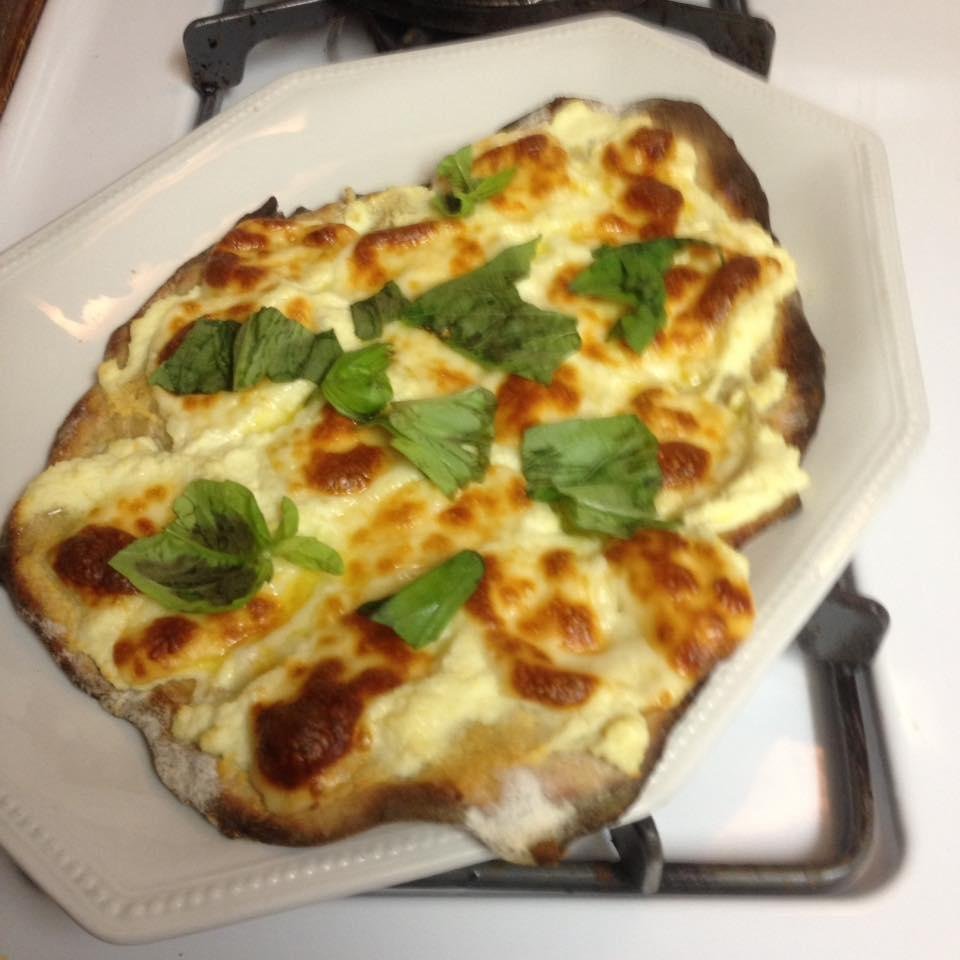 My 1st 2-ingredient pizza crust Pizza. Lemon-zested Ricotta, Mozz pieces. Basil. Yum.