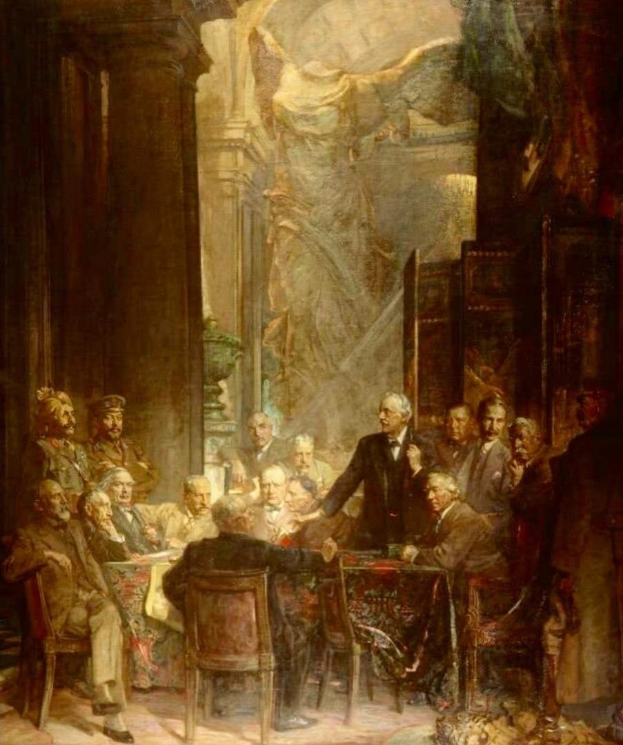 Lord Milner is seated on the right of Winston Churchill.