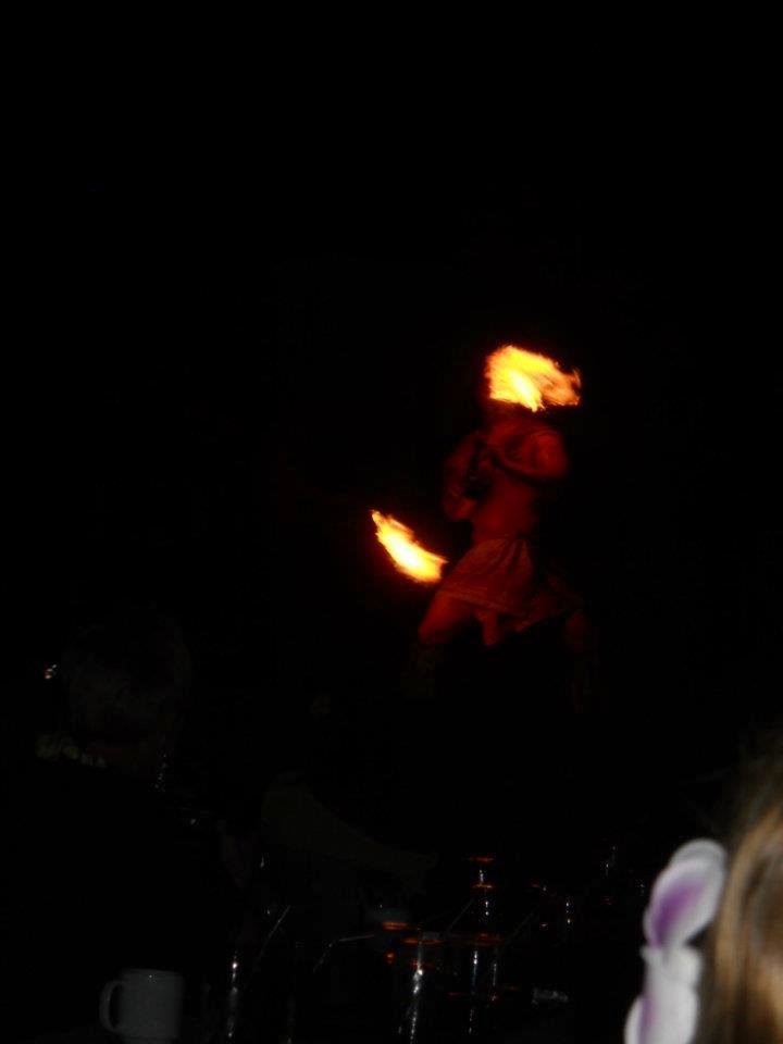 Twirling a firey baton.