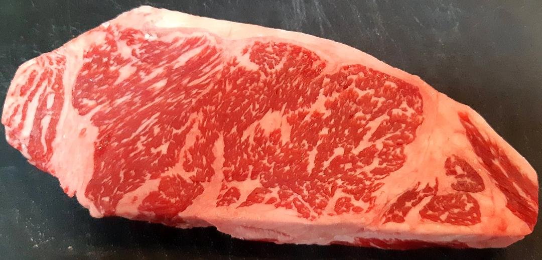 My birthday month is not over yet!! Linda bought me this Wagyu Striploin steak today to celebrate my 66th birthday. I've never had Wagyu beef before and it is supposed to be the best beef in the world and at almost $52.00