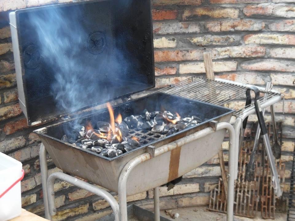 Bob's Dad gave him this grill new way back in the early 70's. Notice the old original briquette holder to the right of grill.