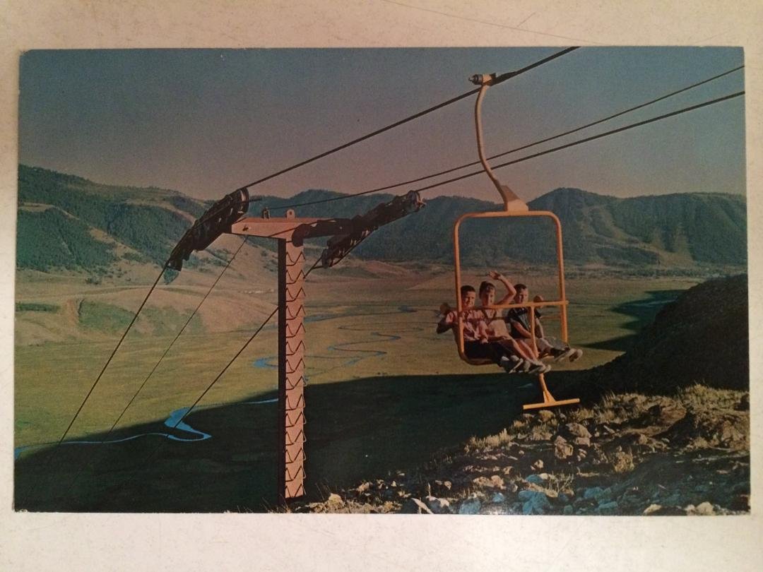 Richard, Debbie, and Edward riding the Frontier Land chairlift, Jackson Hole, Wyoming, about 1965.